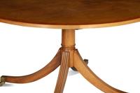 A Regency Style Cross Banded Walnut Top Pedestal Base Breakfast Table