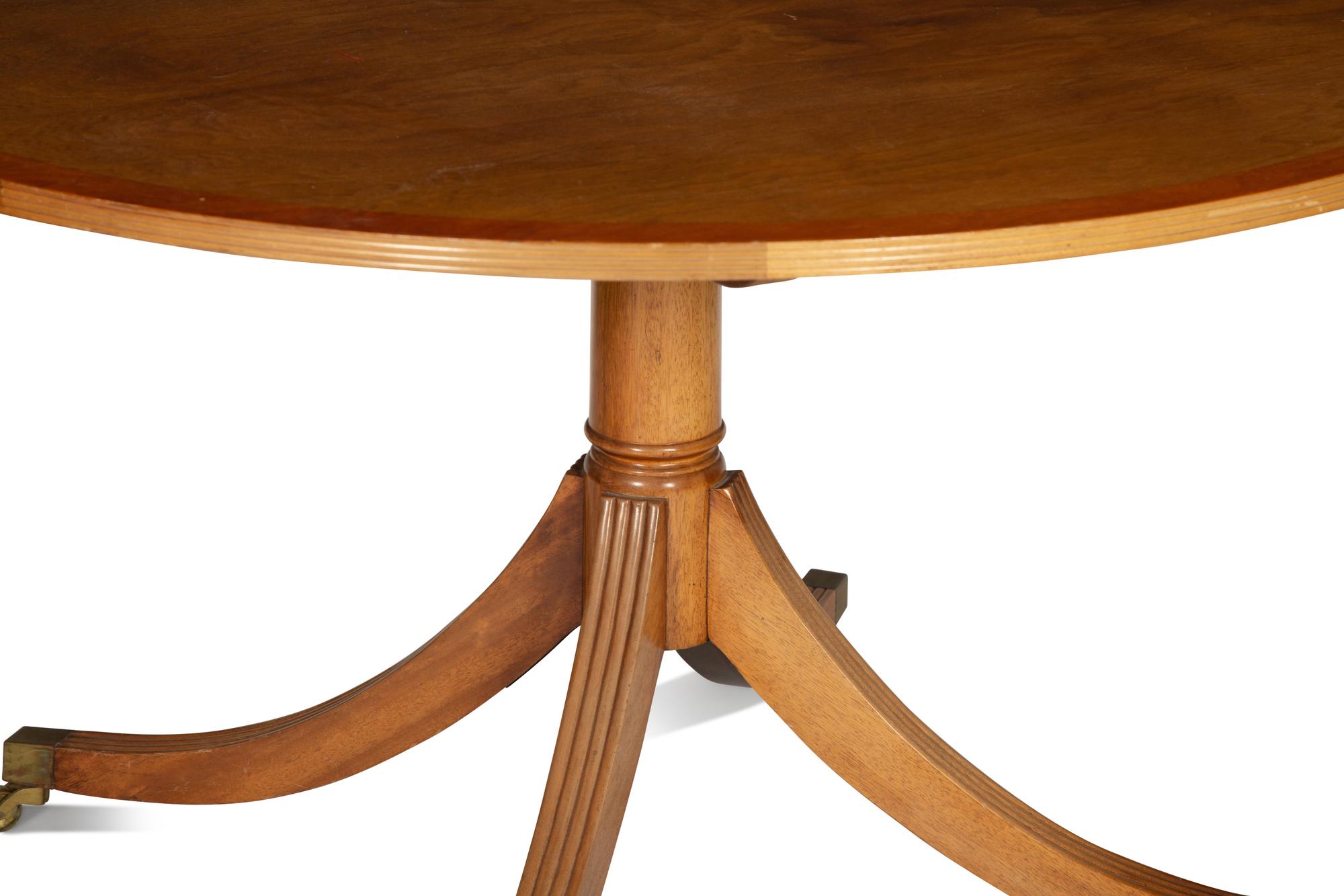 A Regency Style Cross Banded Walnut Top Pedestal Base Breakfast Table