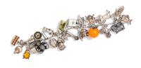 A Vintage Sterling Silver Charm Bracelet with Numerous Attached Charms, 55.60 dwts.