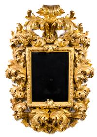 An Italian Baroque Style Giltwood Mirror Height 73 x width 45 inches. — 20TH CENTURY