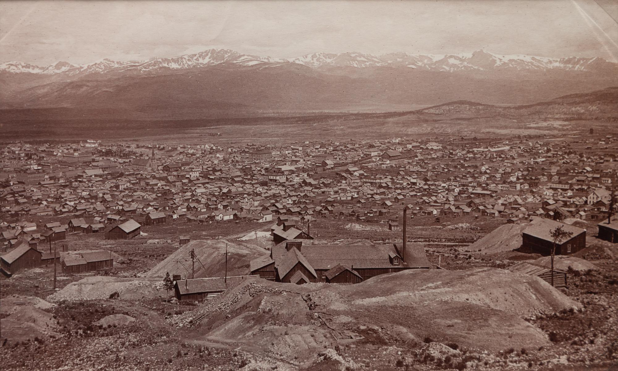 A group of four photographs (8098. Panorama of Denver; Untitled (roof tops of a town; Untitled (mining town); Georgetown)