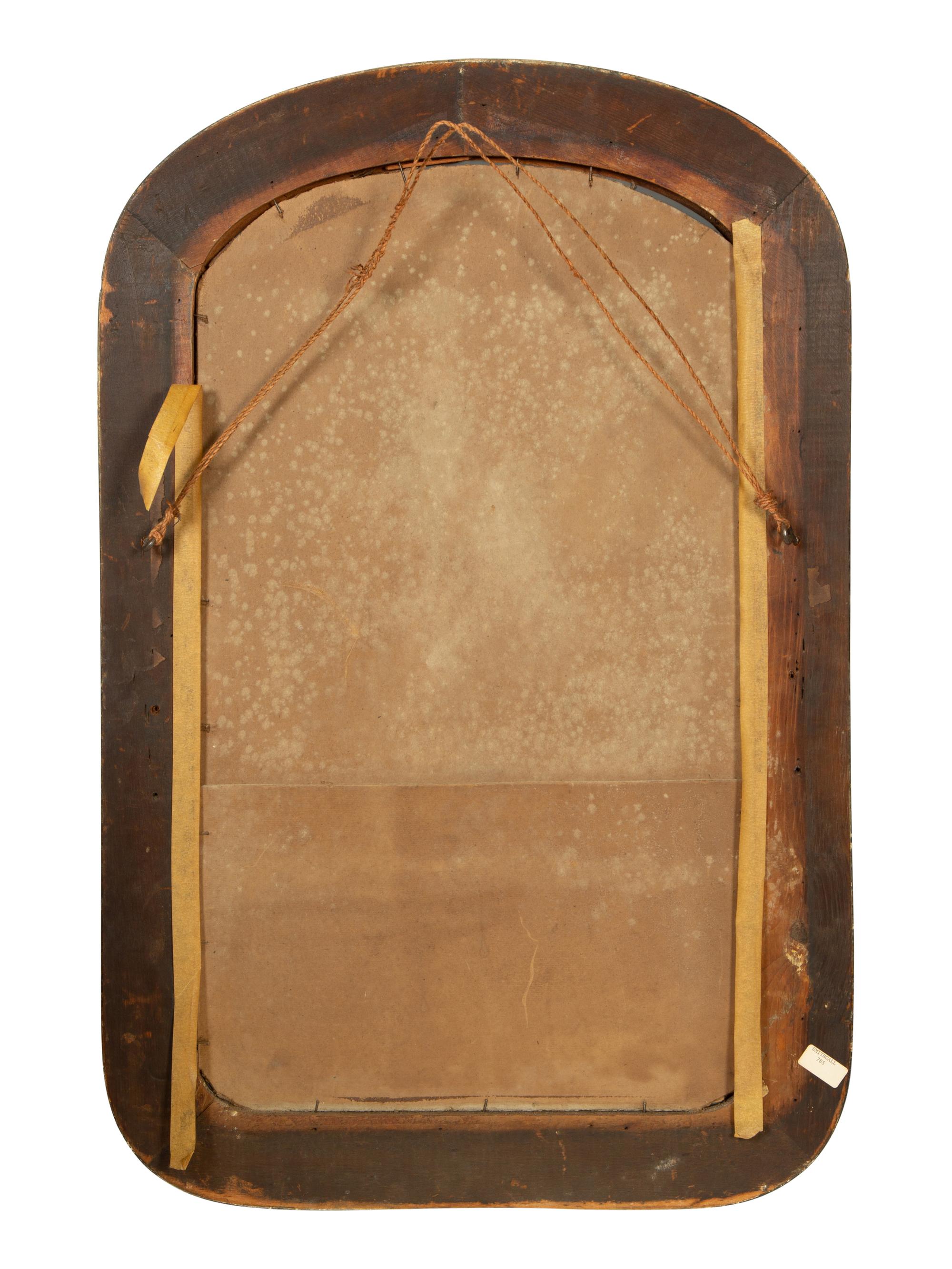 A Victorian Ebonized and Parcel Gilt Mirror