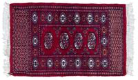 A Bokhara Wool Rug 3 feet 1 inch by 2 feet.