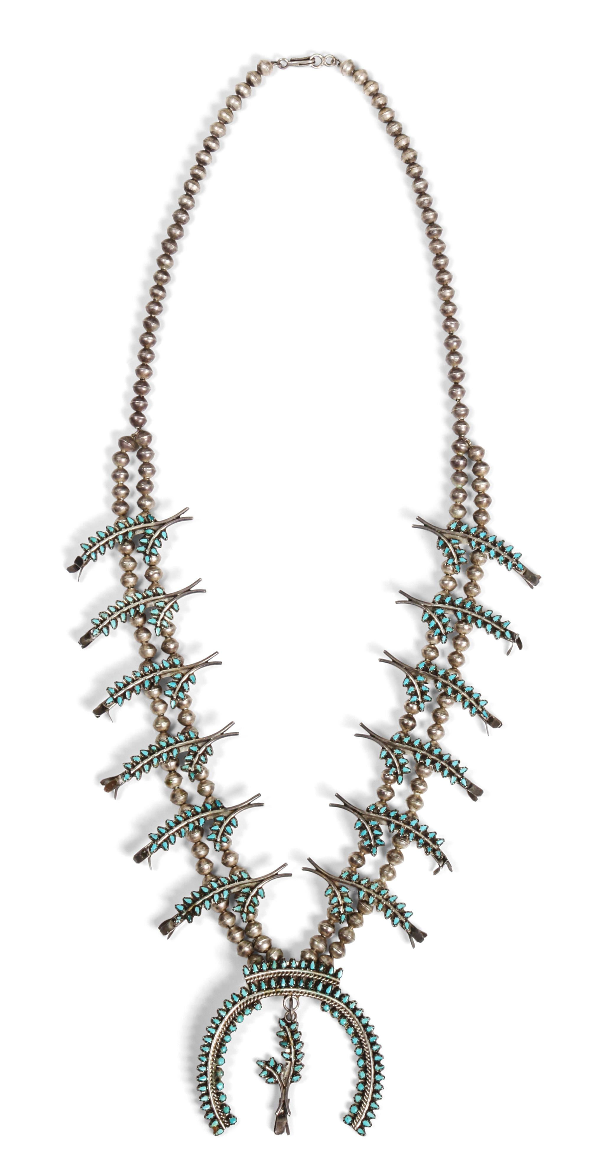 A Zuni Petit Point Squash Blossom Necklace Length 28 inches; naja height 2 1/2 x width 2 1/2 inches.