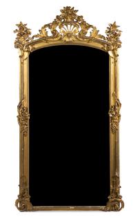 A Rococo Style Giltwood Pier Mirror, Height 98 1/2 x width 52 inches.