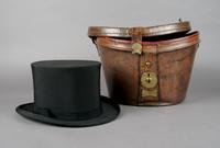 A Leather Hat Box, Height 9 1/2 x width 14 inches.