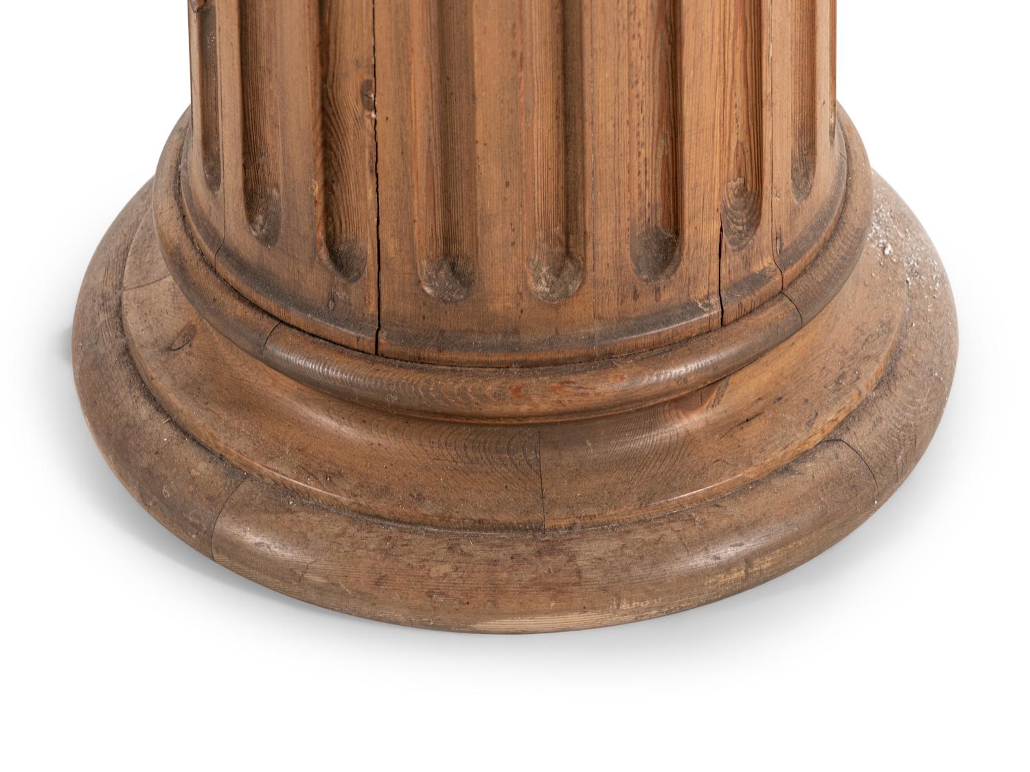 A Pair of Carved Pine Pedestals with Marble Tops