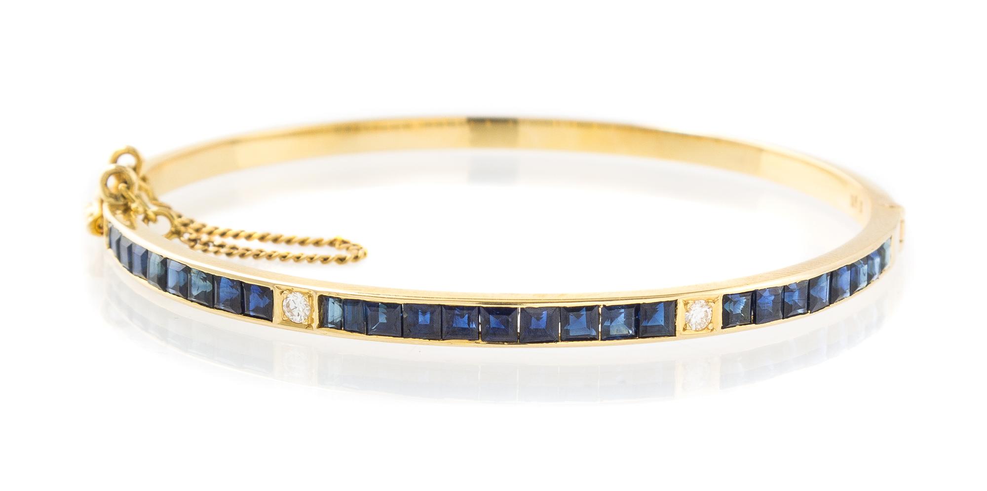 A Yellow Gold, Sapphire and Diamond Bangle Bracelet, 7.60 dwts.