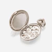 An eighteen karat white gold and diamond pendant locket