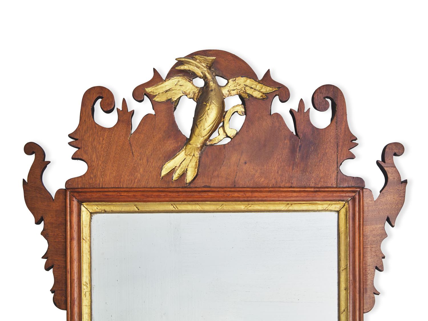 A Chippendale Fret-Carved and Parcel-Gilt Mahogany Looking Glass