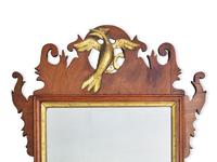 A Chippendale Fret-Carved and Parcel-Gilt Mahogany Looking Glass