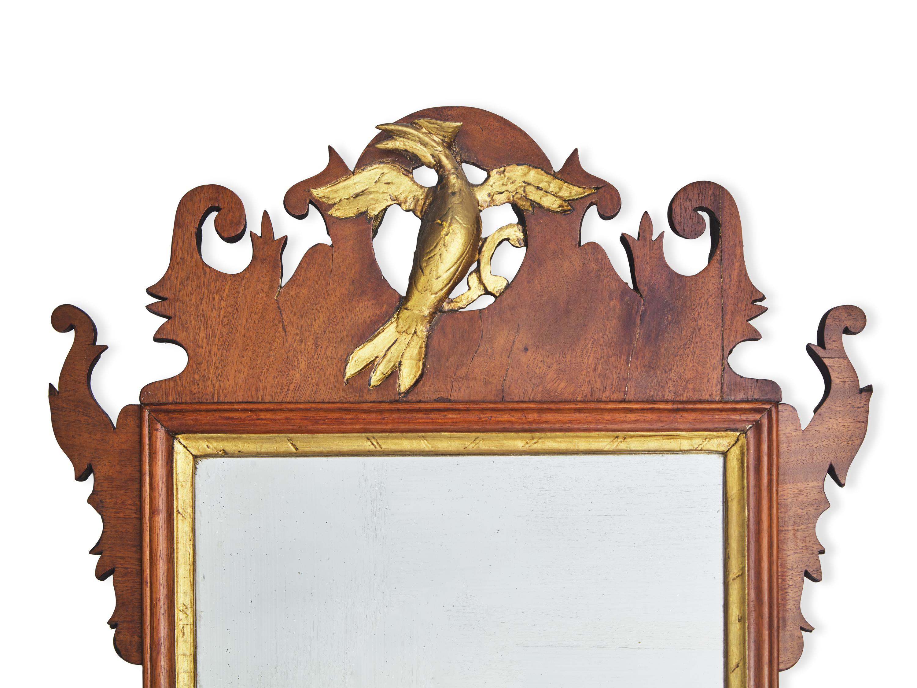 A Chippendale Fret-Carved and Parcel-Gilt Mahogany Looking Glass
