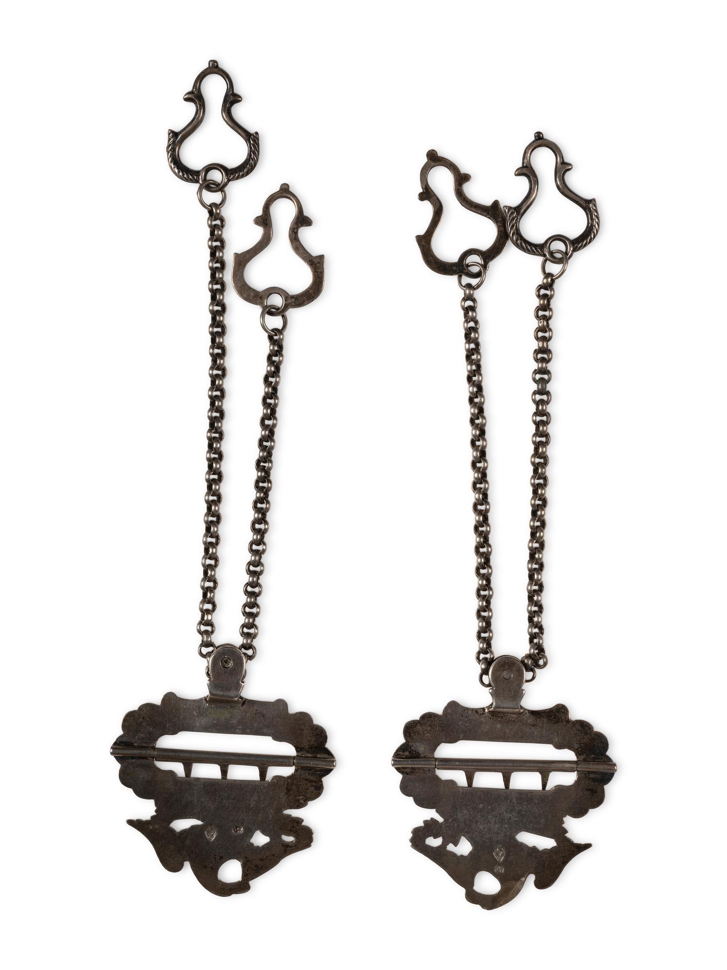 Silver eagle suspender buckles.