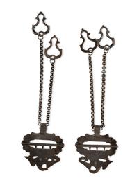 Silver eagle suspender buckles.