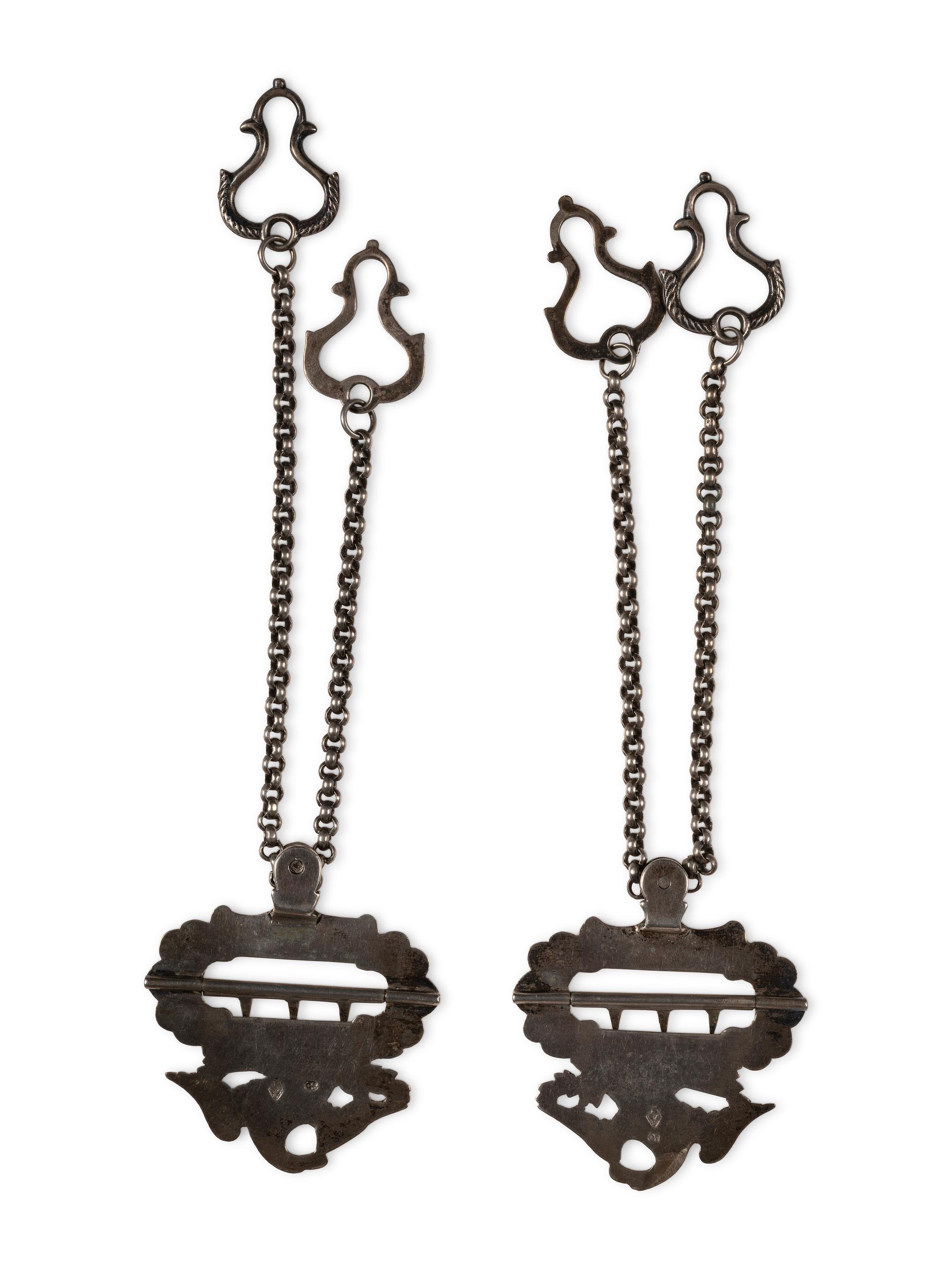 Silver eagle suspender buckles.