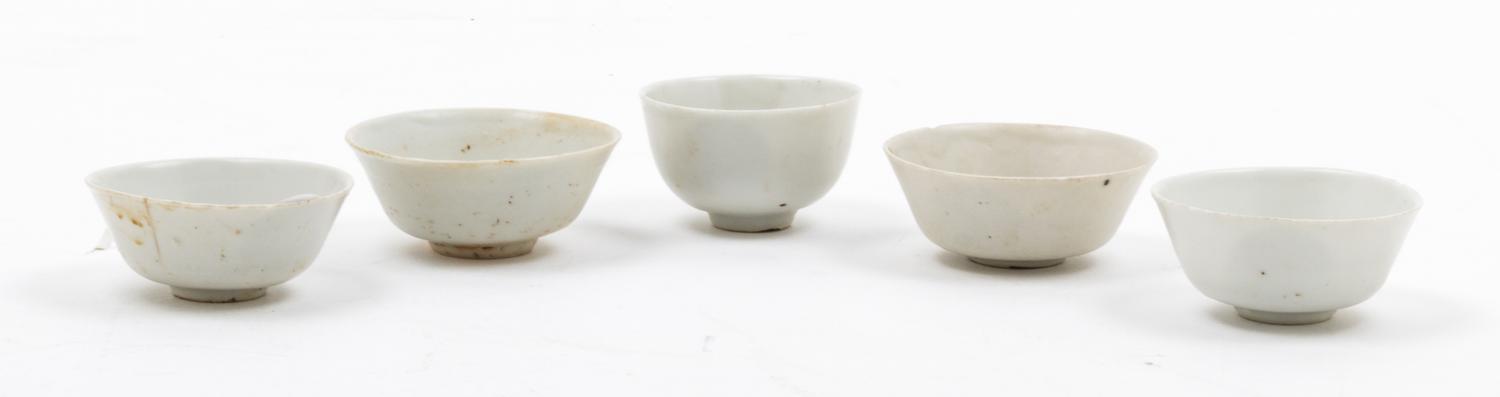 A Set of Five White Glazed Porcelain Cups Diameter of largest 3 inches.