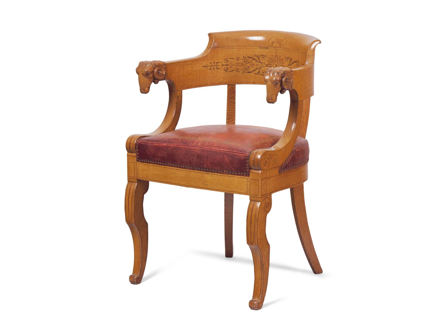 A Charles X Amaranth-Inlaid Golden Oak and Rams' Head Fauteuil