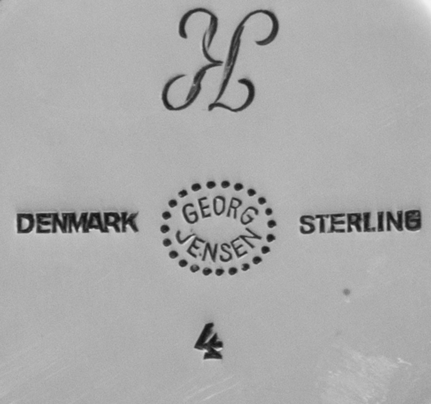 A Group of Danish Silver Table Articles, Georg Jensen Silversmithy, Copenhagen, 1945-77, comprising eight casters in the Acorn pattern,