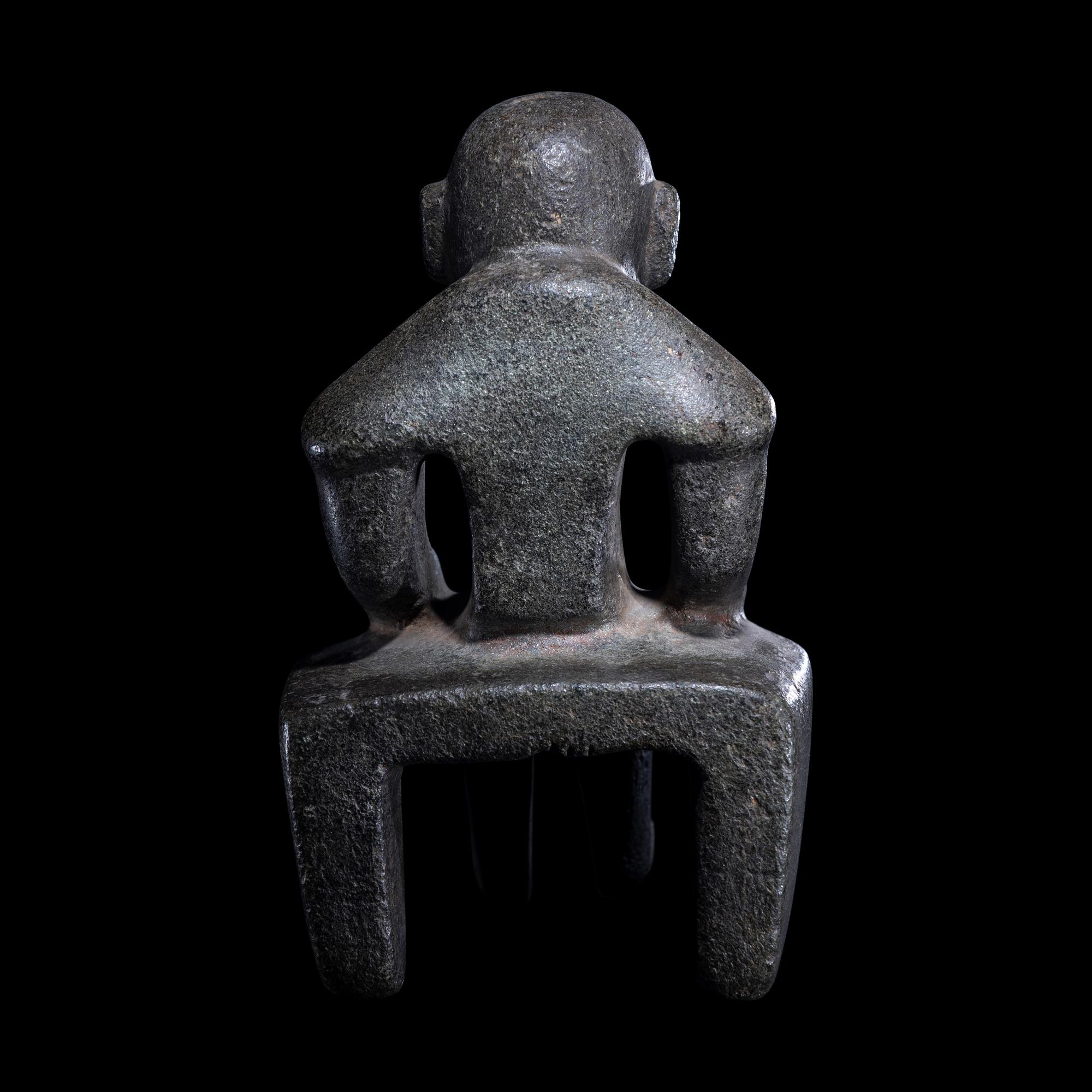 An Olmec Serpentine Seated Figure