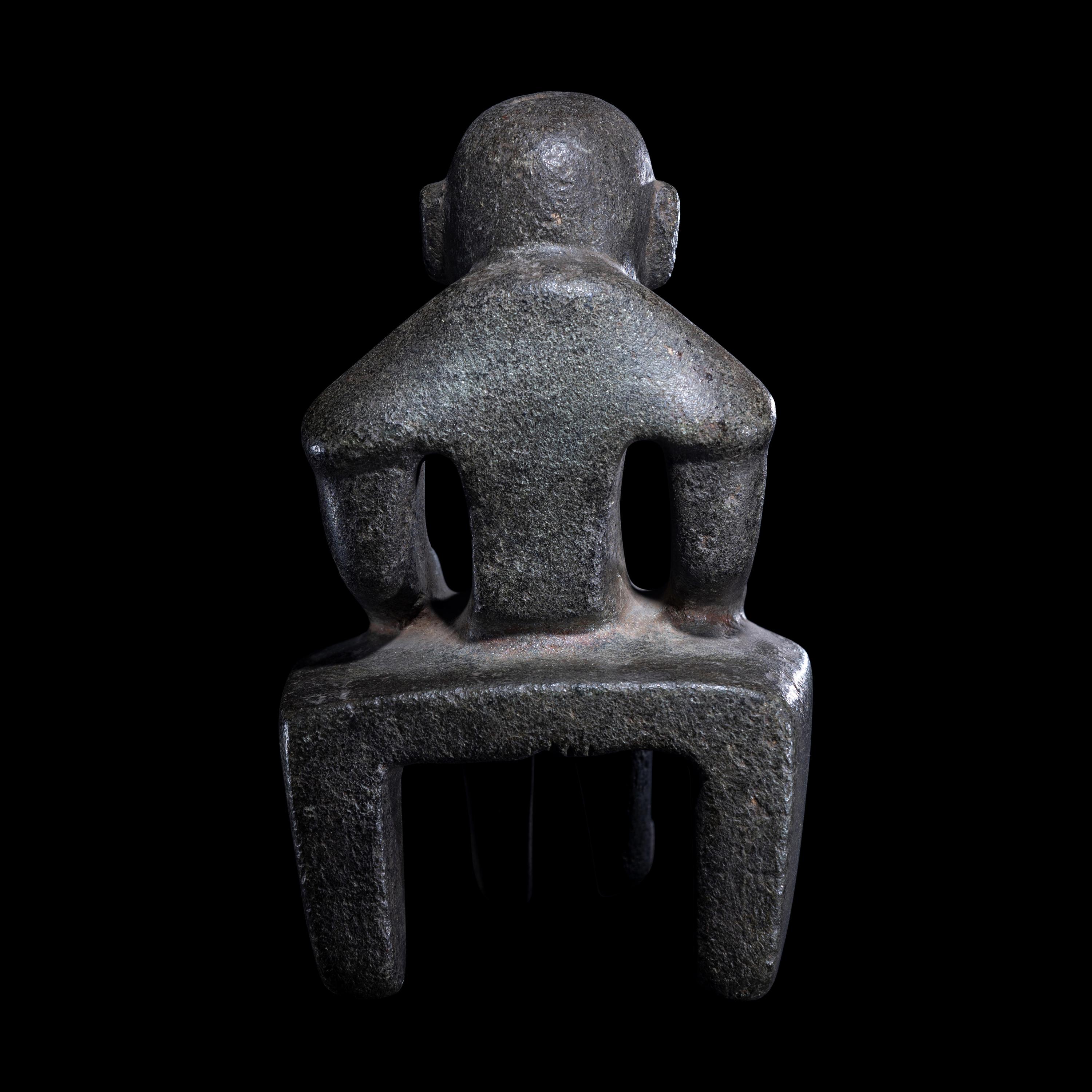 An Olmec Serpentine Seated Figure