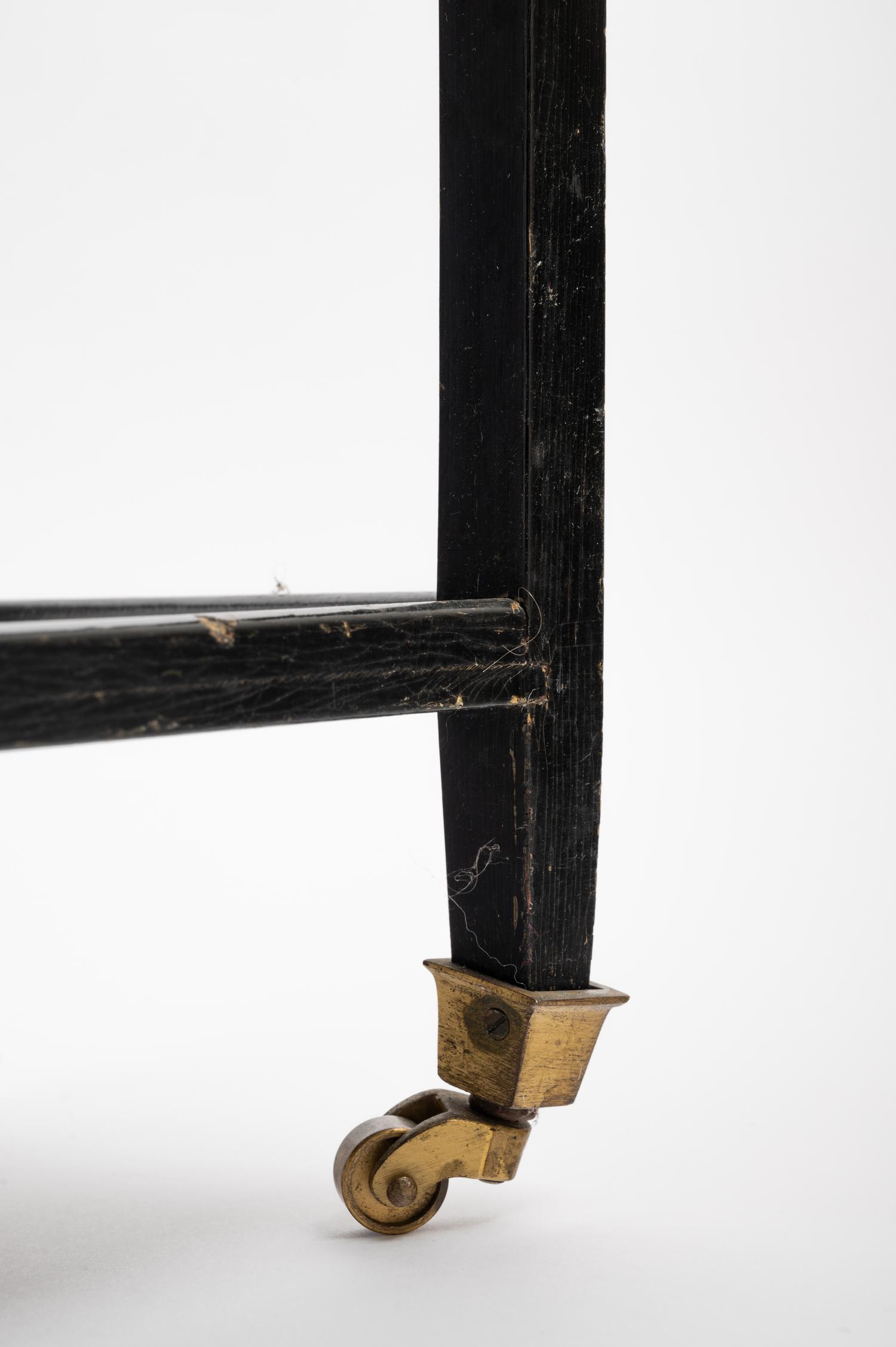 A Black Painted "Telephone Table" in the Style of Karl Springer