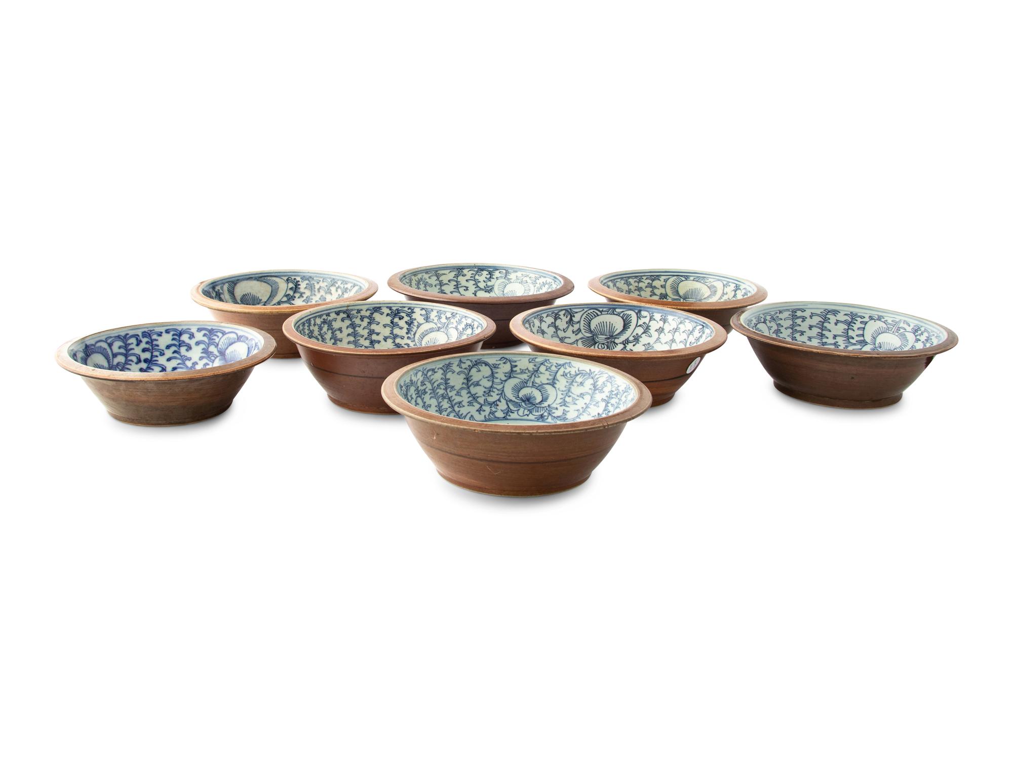 A Set of Eight Chinese Export Brown Glazed and Blue and White Bowls