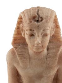 A White Stone Figure of a Kneeling Pharaoh