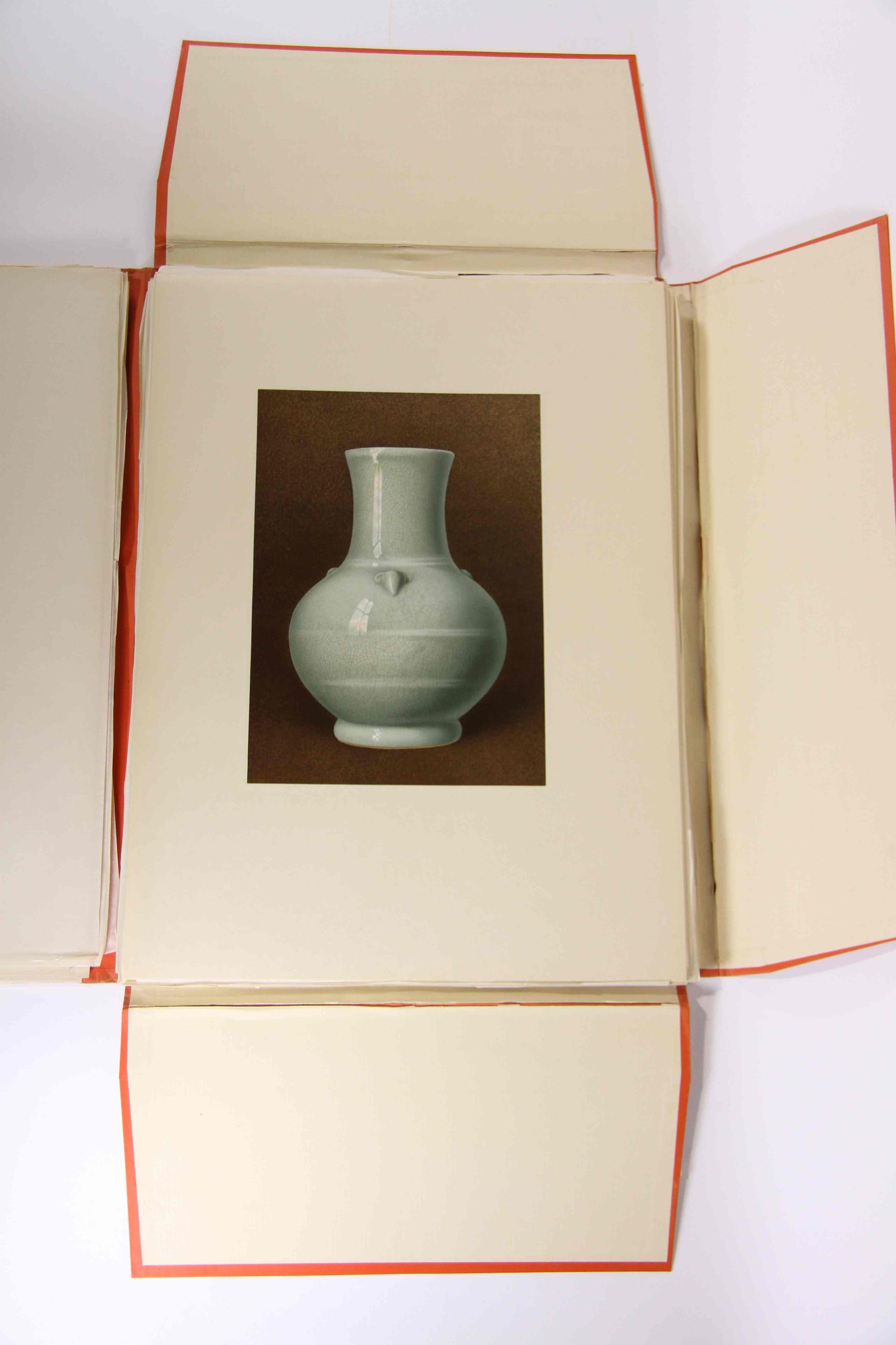 A Group of Four Ceramic Plates Height of tallest 22 1/2 inches.