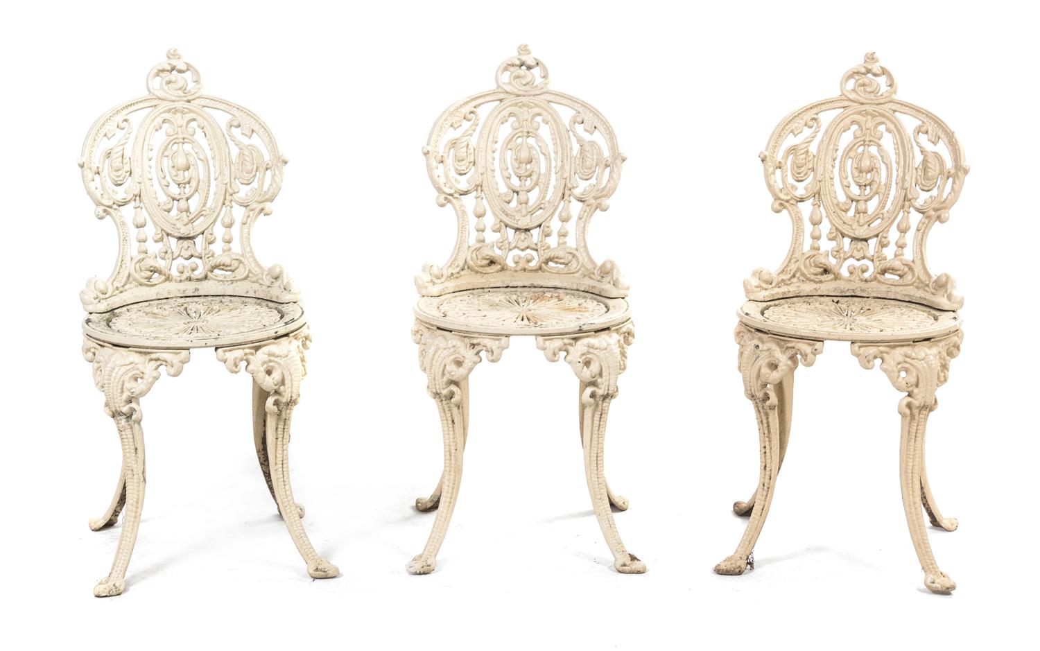 A Set of Three Cast Iron Chairs, Height 34 1/2 inches.