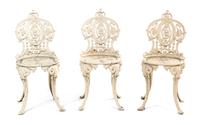 A Set of Three Cast Iron Chairs, Height 34 1/2 inches.