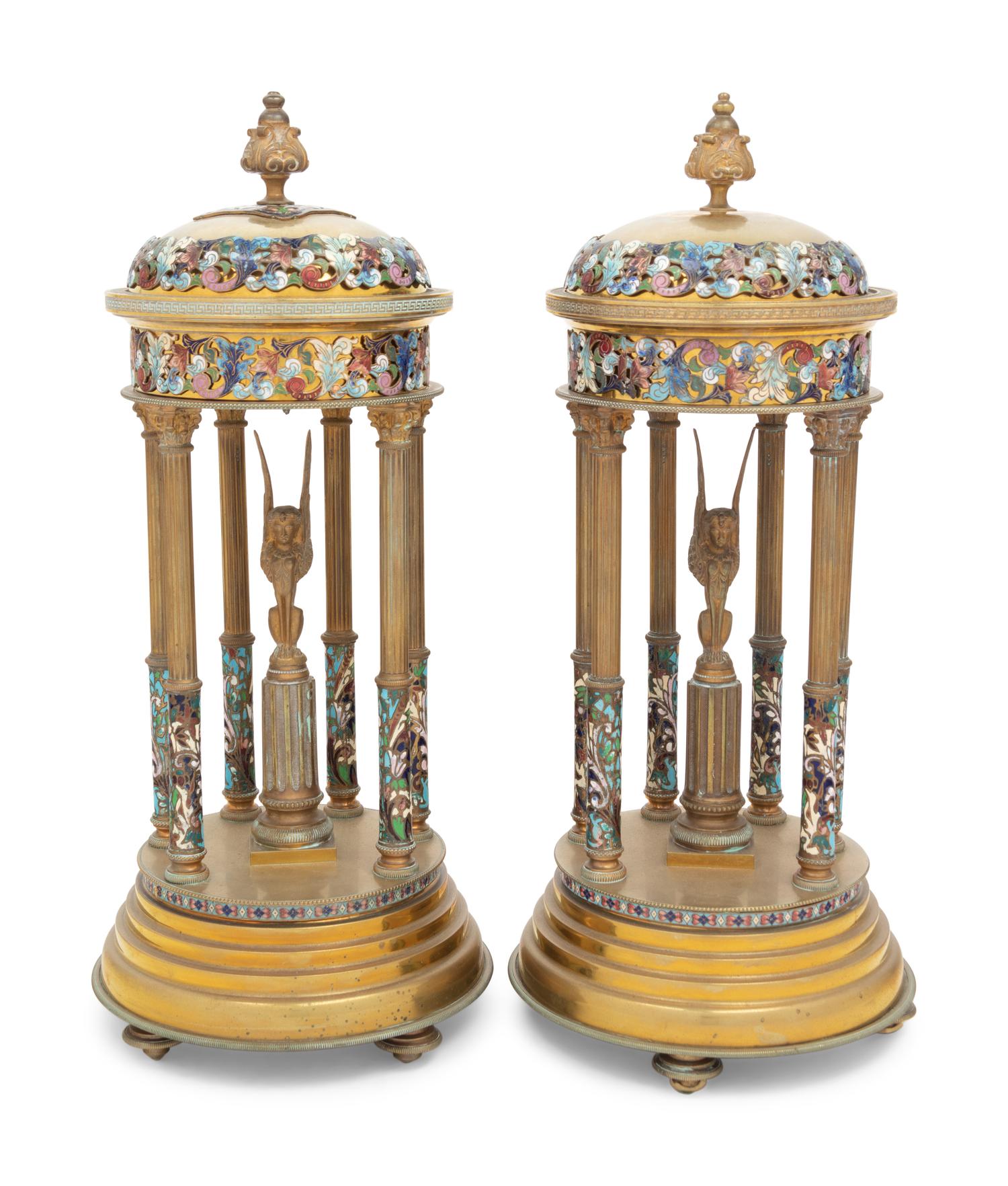 A Pair of French Gilt Bronze and Champlevé Enamel Stands with Interior Sphinxes