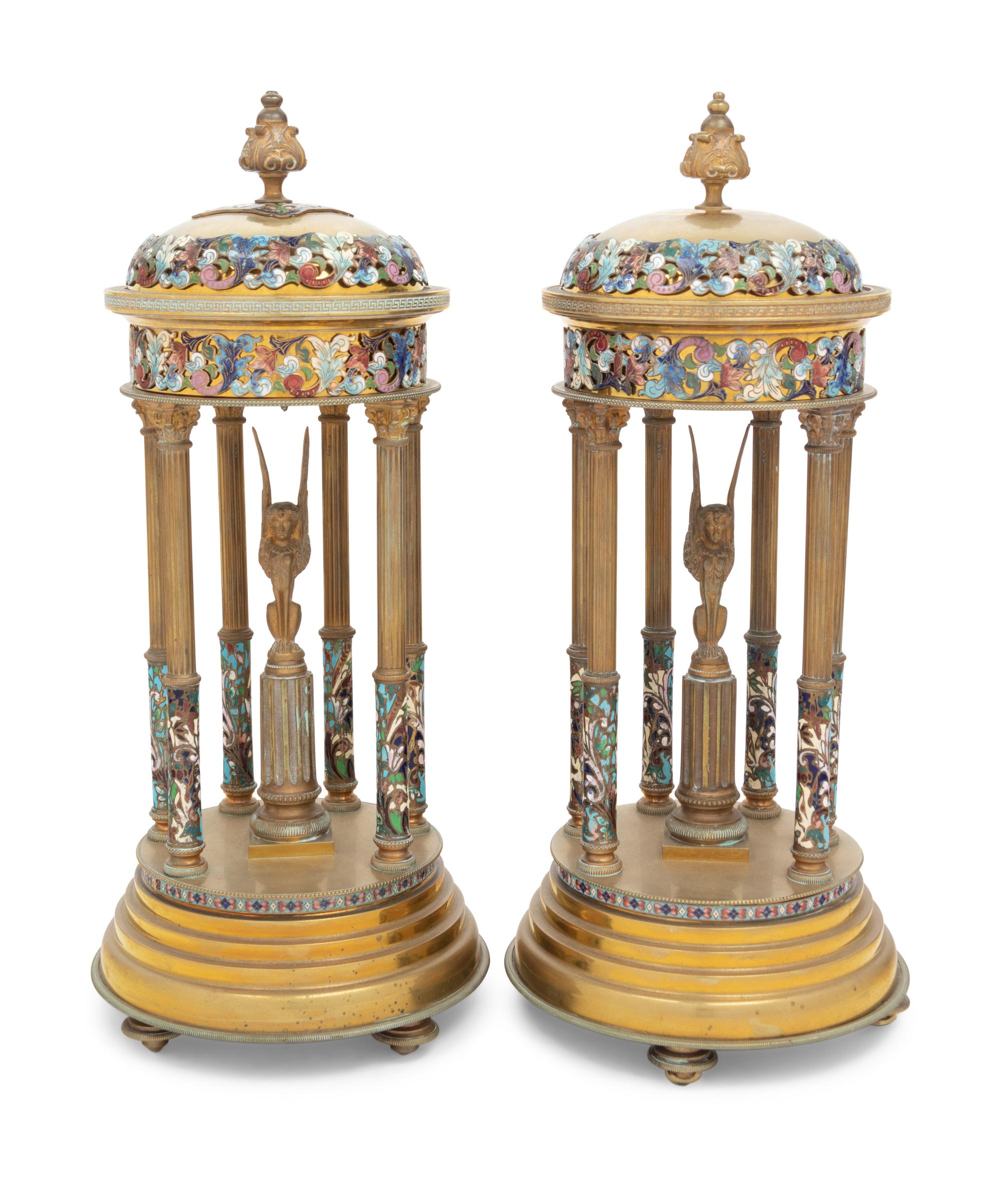 A Pair of French Gilt Bronze and Champlevé Enamel Stands with Interior Sphinxes