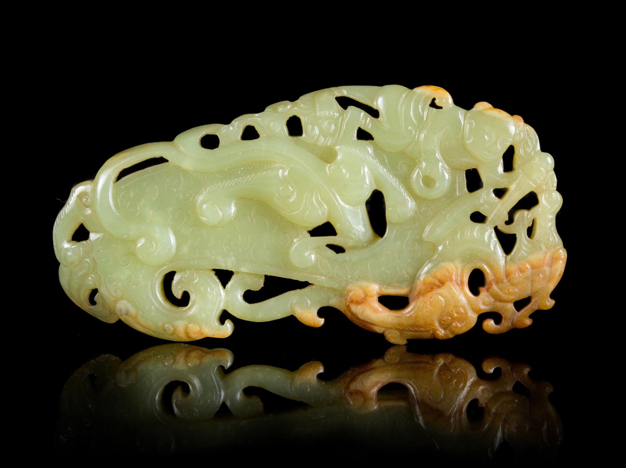 A Reticulated Celadon and Russet Jade Plaque Length 3 5/8 inches.