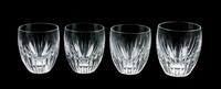 A Set of Four Baccarat Cut Glass Tumblers Height 3 5/8 inches.