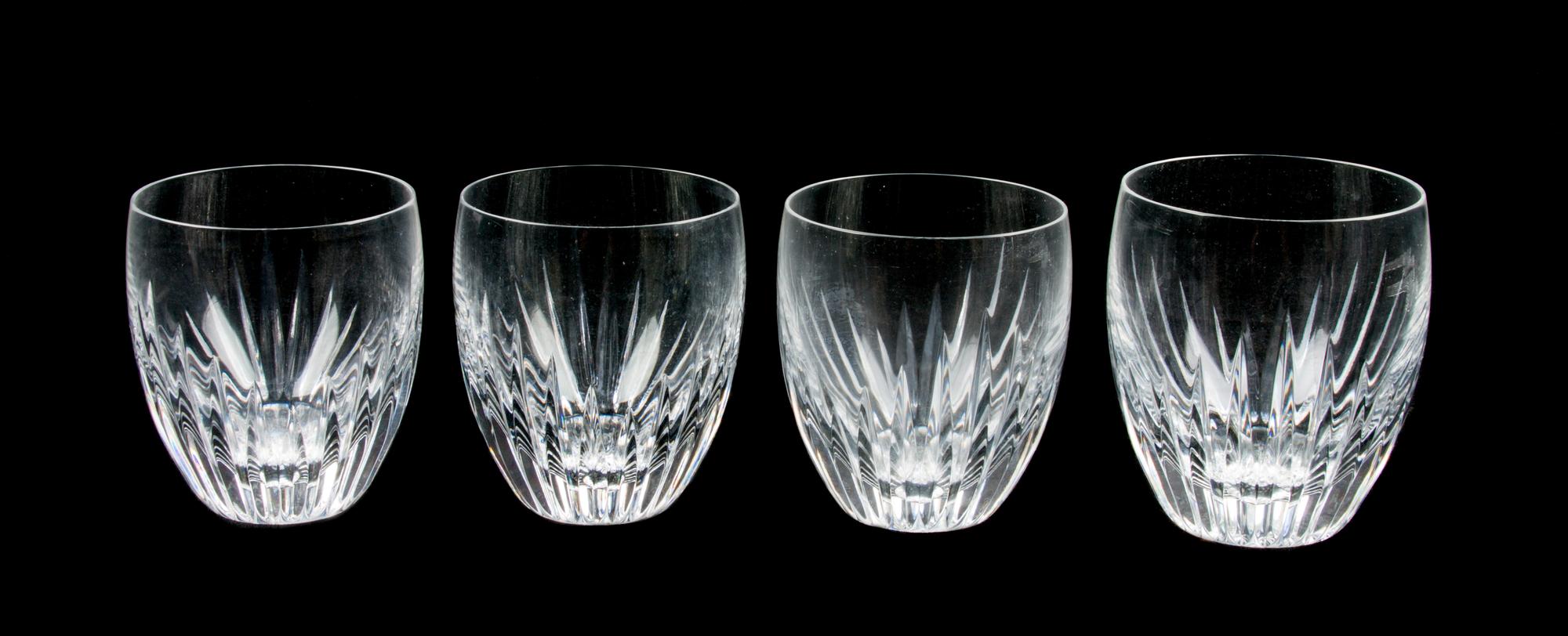 A Set of Four Baccarat Cut Glass Tumblers Height 3 5/8 inches.