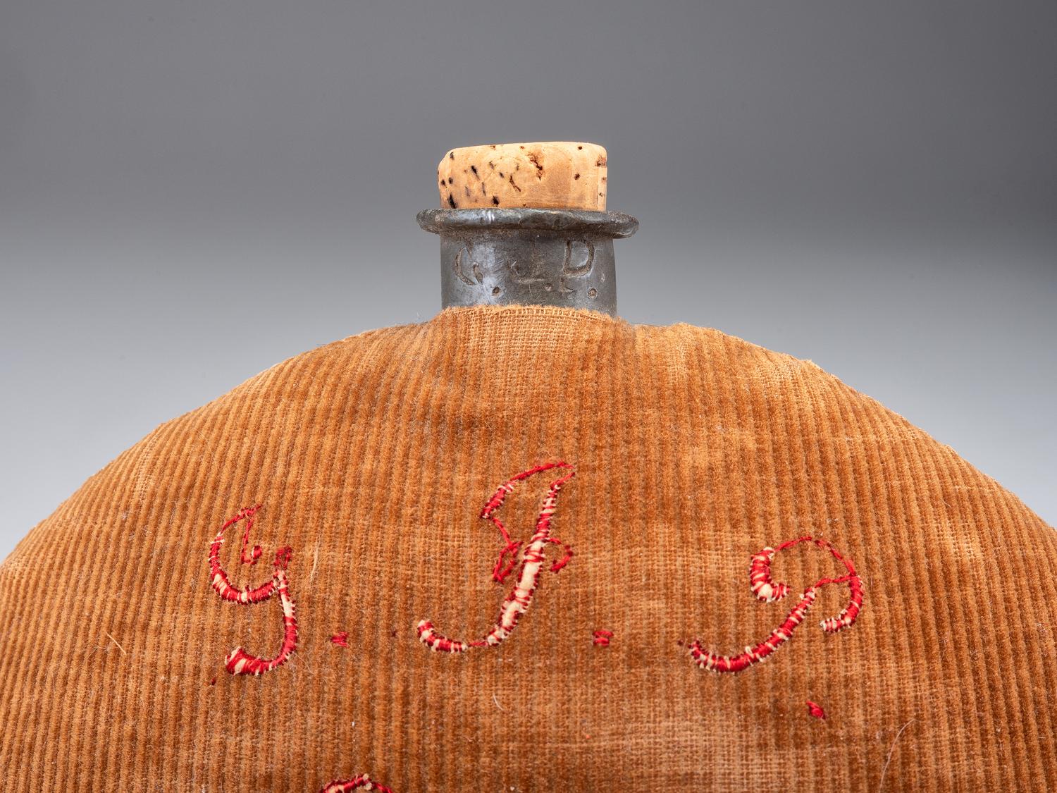 [CIVIL WAR]. A group of 3 items identified to George J. Putney, Company E, 29th Ohio Infantry, comprised of a silver corps badge engraved with battle honors, embellished canteen, and book taken from wreckage at Bristoe Station.