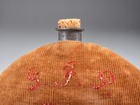 [CIVIL WAR]. A group of 3 items identified to George J. Putney, Company E, 29th Ohio Infantry, comprised of a silver corps badge engraved with battle honors, embellished canteen, and book taken from wreckage at Bristoe Station.