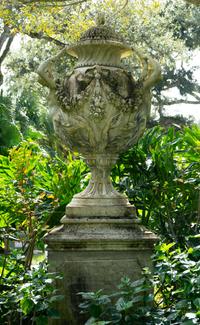 An English Monumental Carved Stone Urn on a Pedestal Base