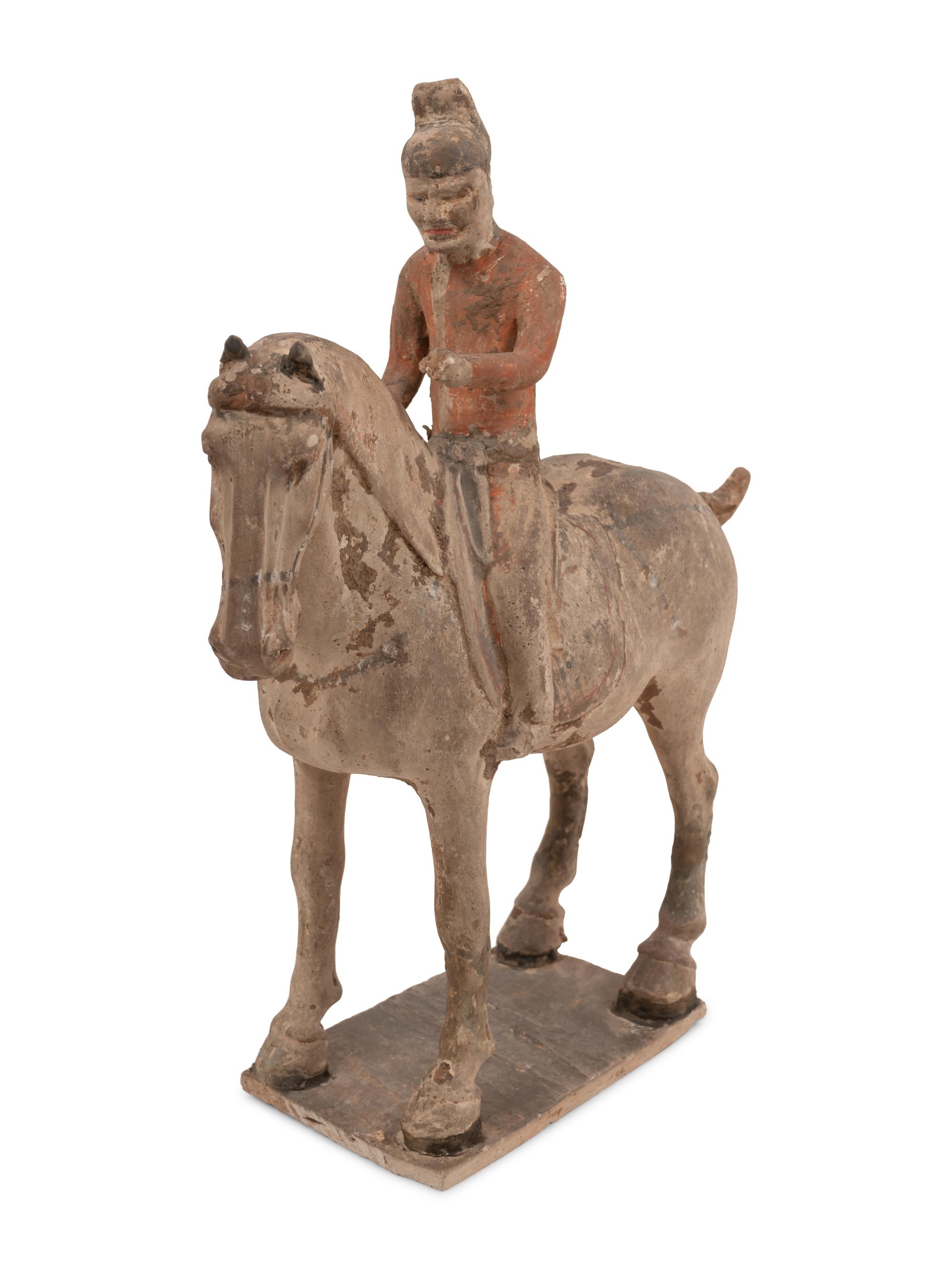 A Pair of Chinese Glazed Terra Cotta Horses with Riders and Three Glazed Terra Cotta Figures