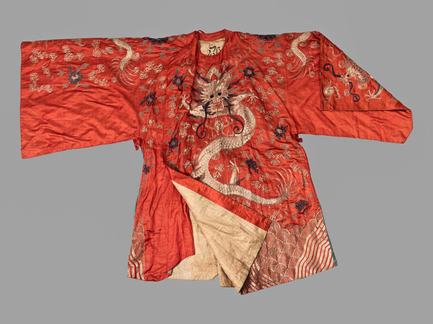 A Chinese Orange Ground Embroidered Silk Theatrical Dragon Robe