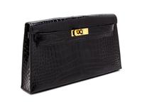 An Hermes Black Shiny Alligator Kelly Clutch Bag, 11 x 6 x 1 1/2 inches.