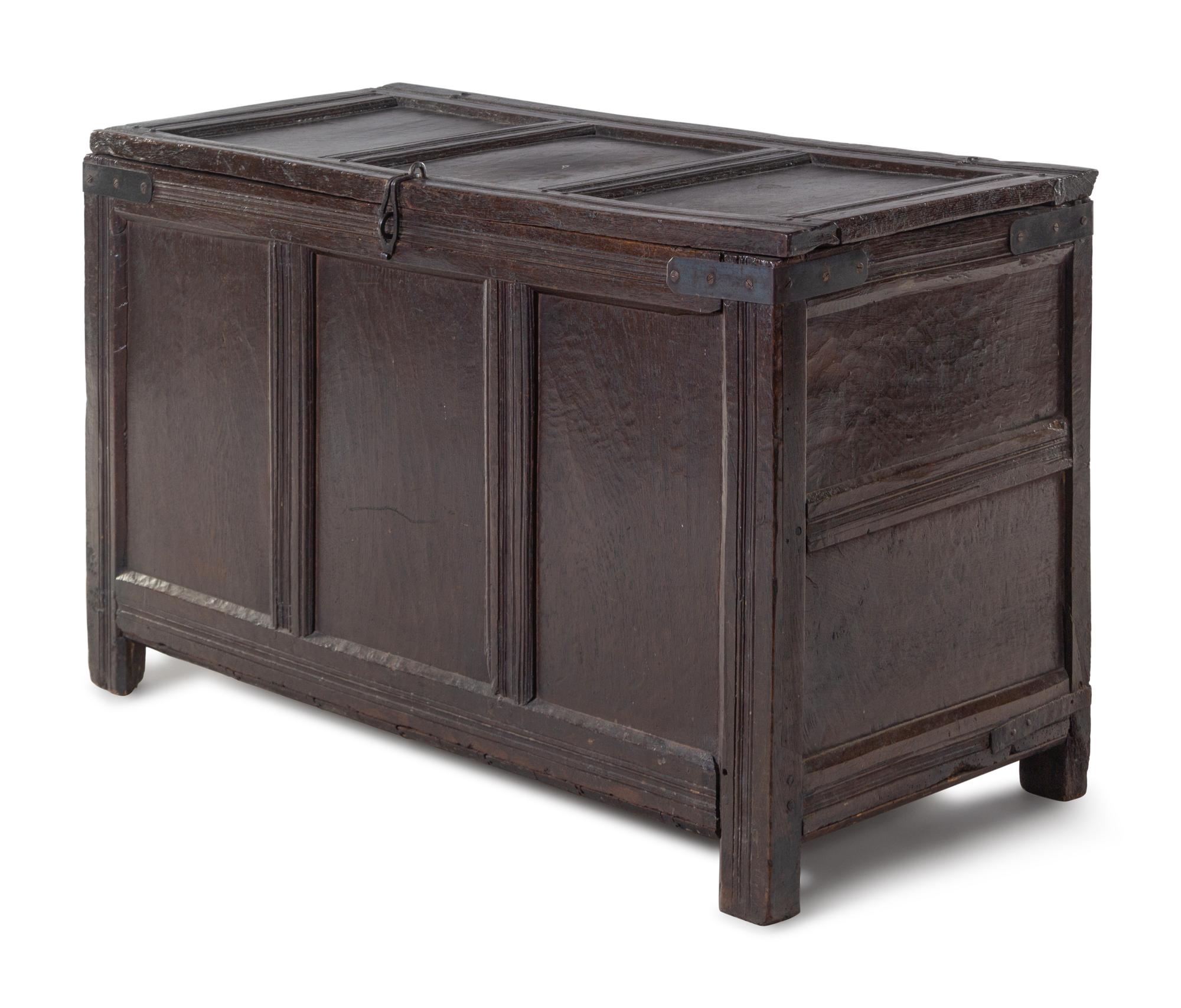 A Jacobean Iron Mounted Molded and Paneled Oak Storage Chest