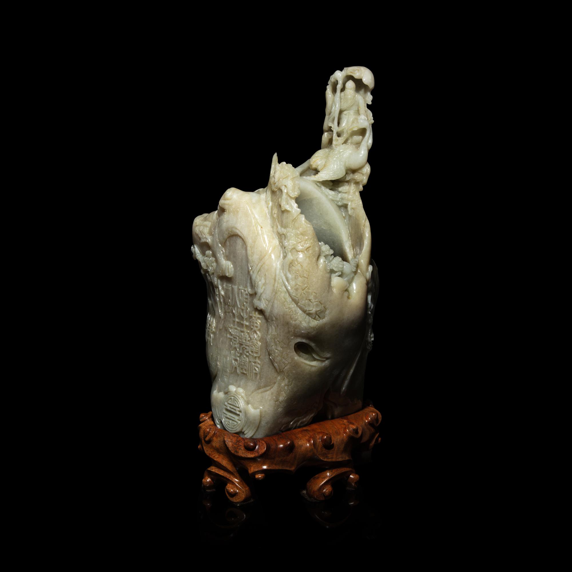 A Chinese Pale Celadon and Russet Jade 'Tree-Trunk' Brushpot, Bitong, 20th Century — 近代 青白玉仿木大筆筒