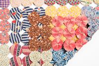 A Pieced Cotton Yo-Yo Quilt