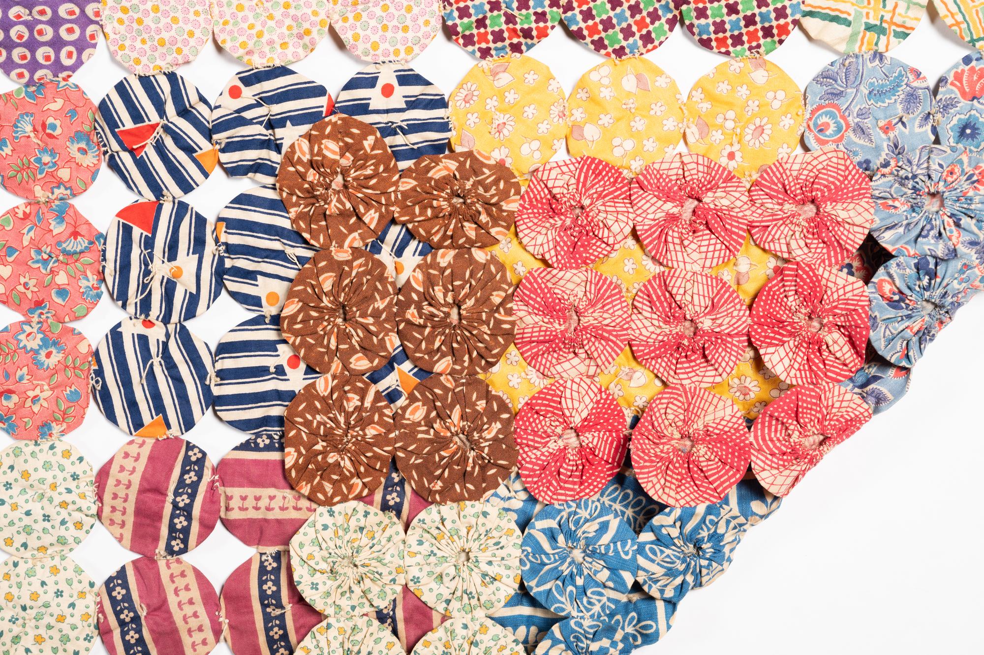 A Pieced Cotton Yo-Yo Quilt