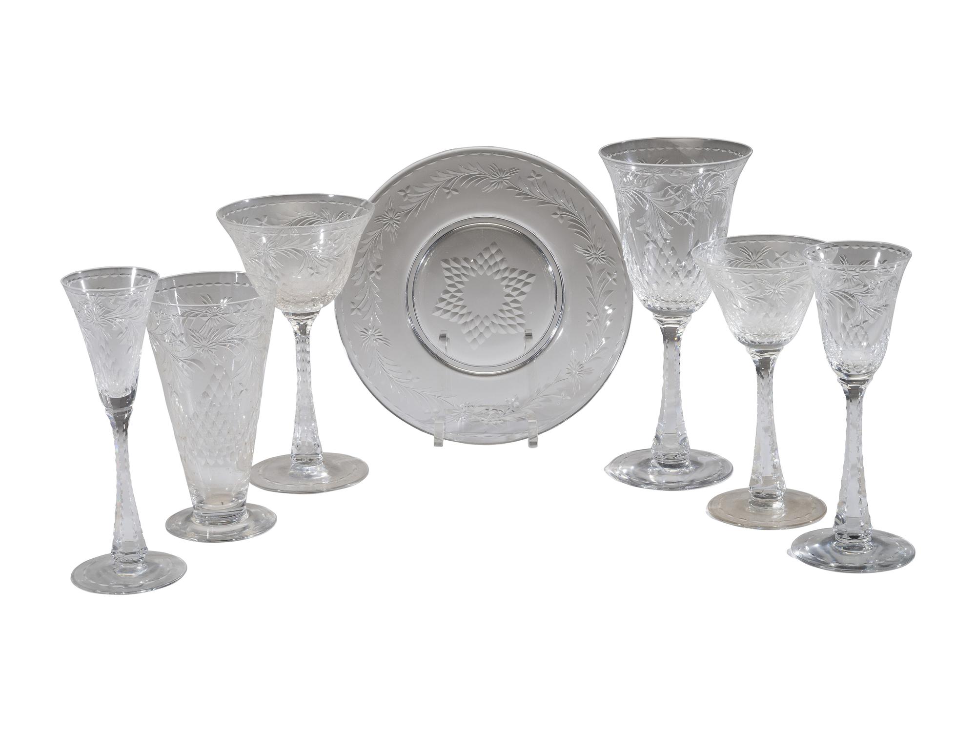 A Collection of Cut Glass Stemware and Plates