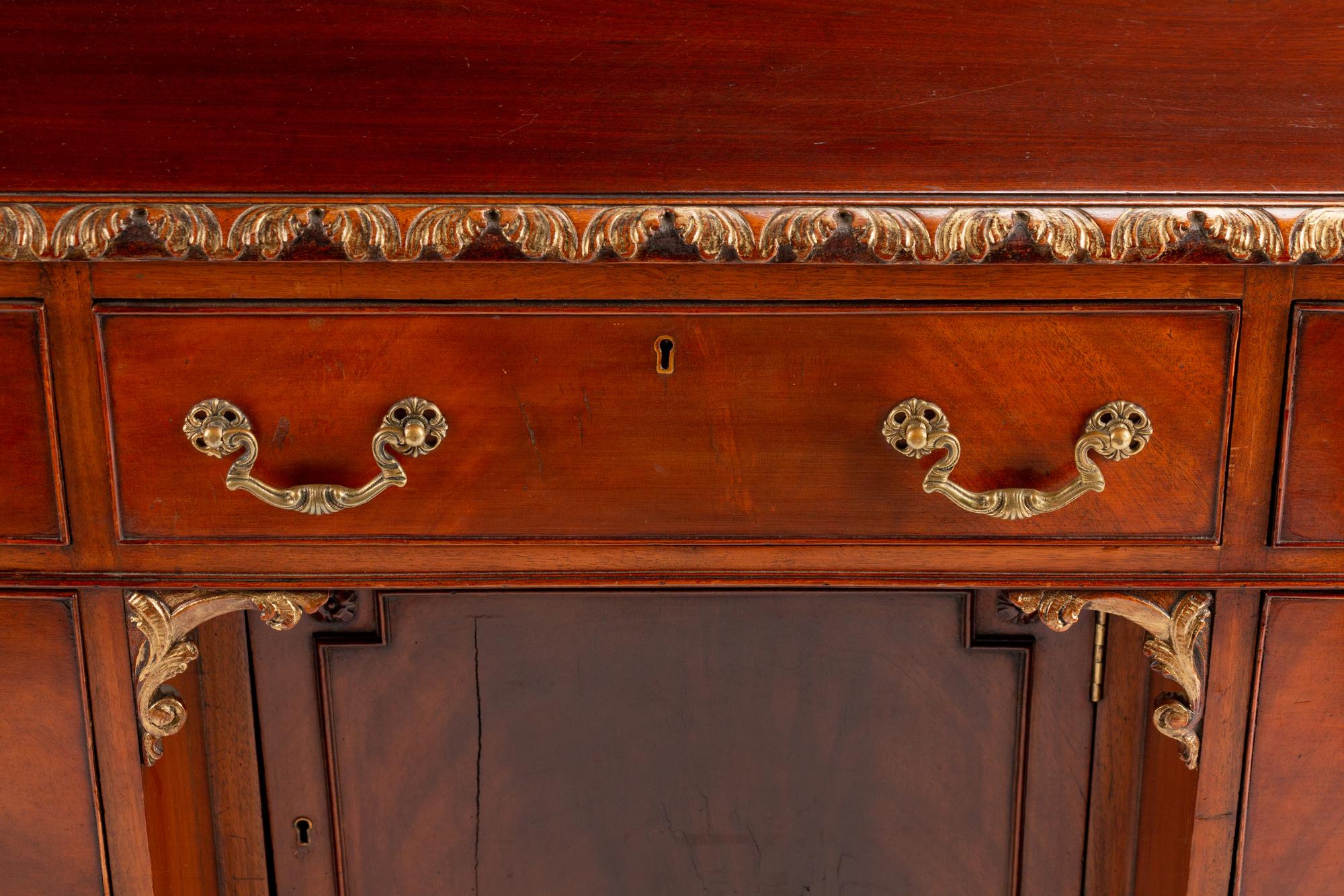 A George III Style Parcel-Gilt Mahogany Kneehole Desk — LATE 19TH/EARLY 20TH CENTURY
