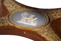A French Gilt Bronze and Jasperware Mounted Burlwood Dining Suite