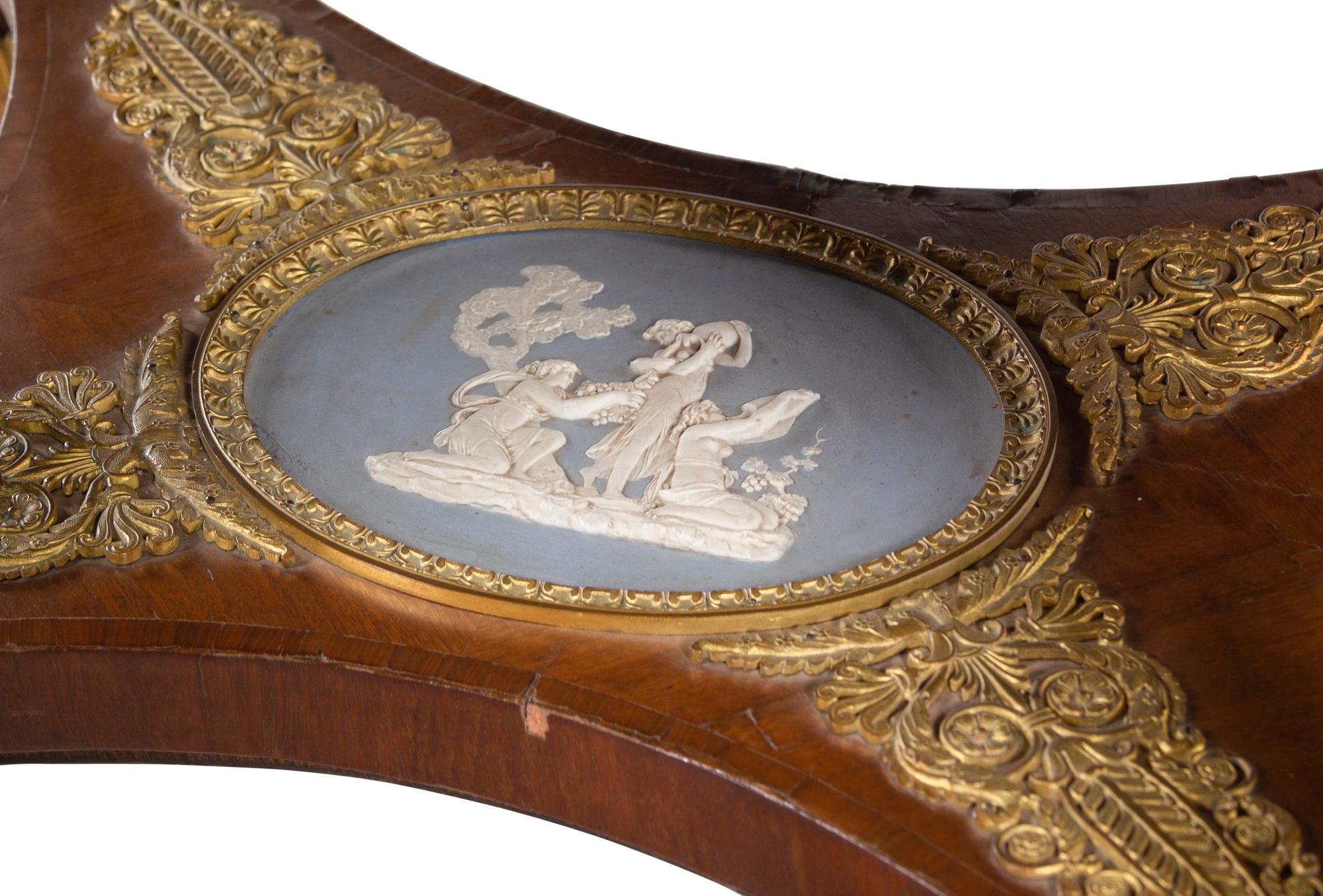 A French Gilt Bronze and Jasperware Mounted Burlwood Dining Suite