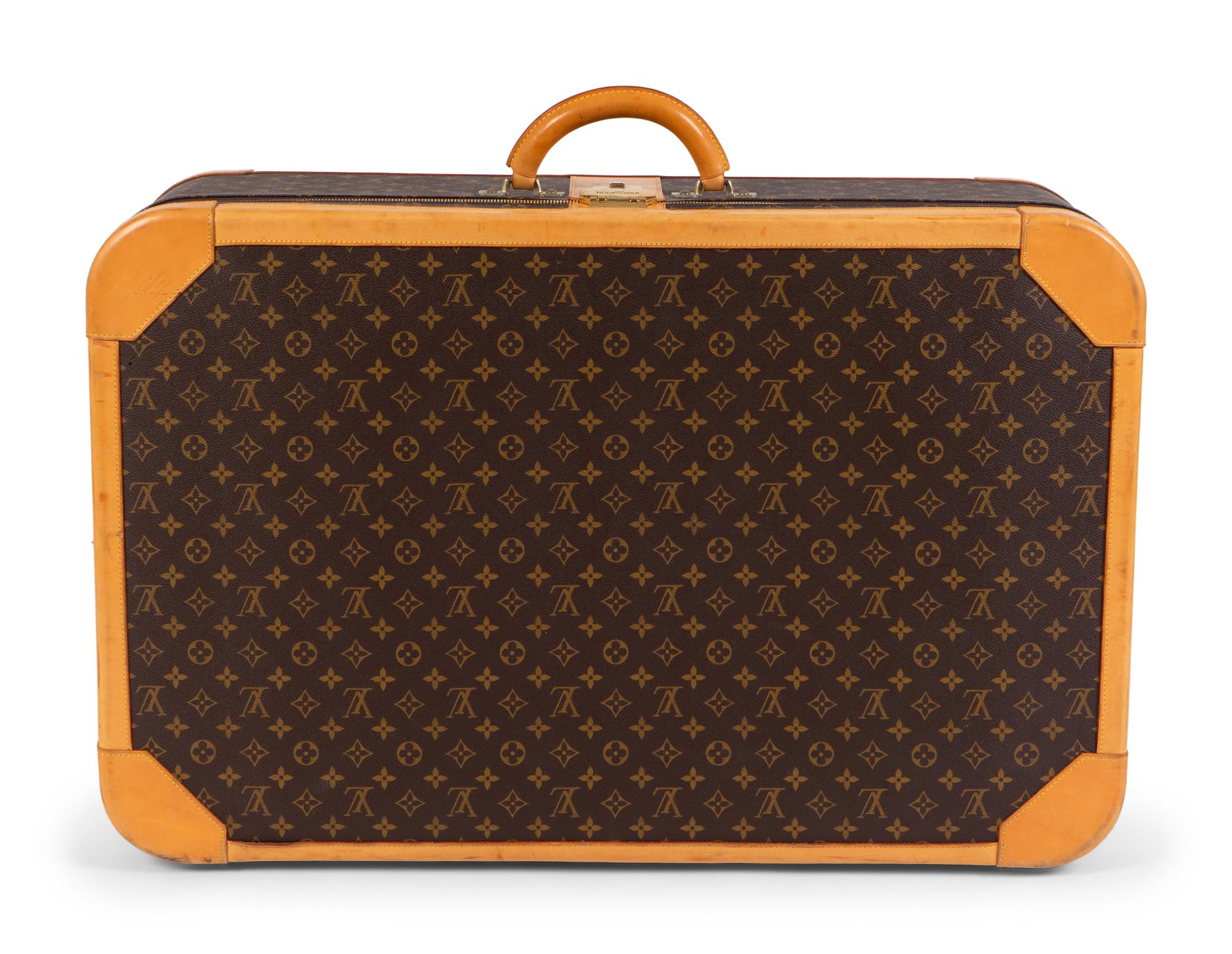 A Louis Vuitton Hard Sided Suitcase — 20TH CENTURY